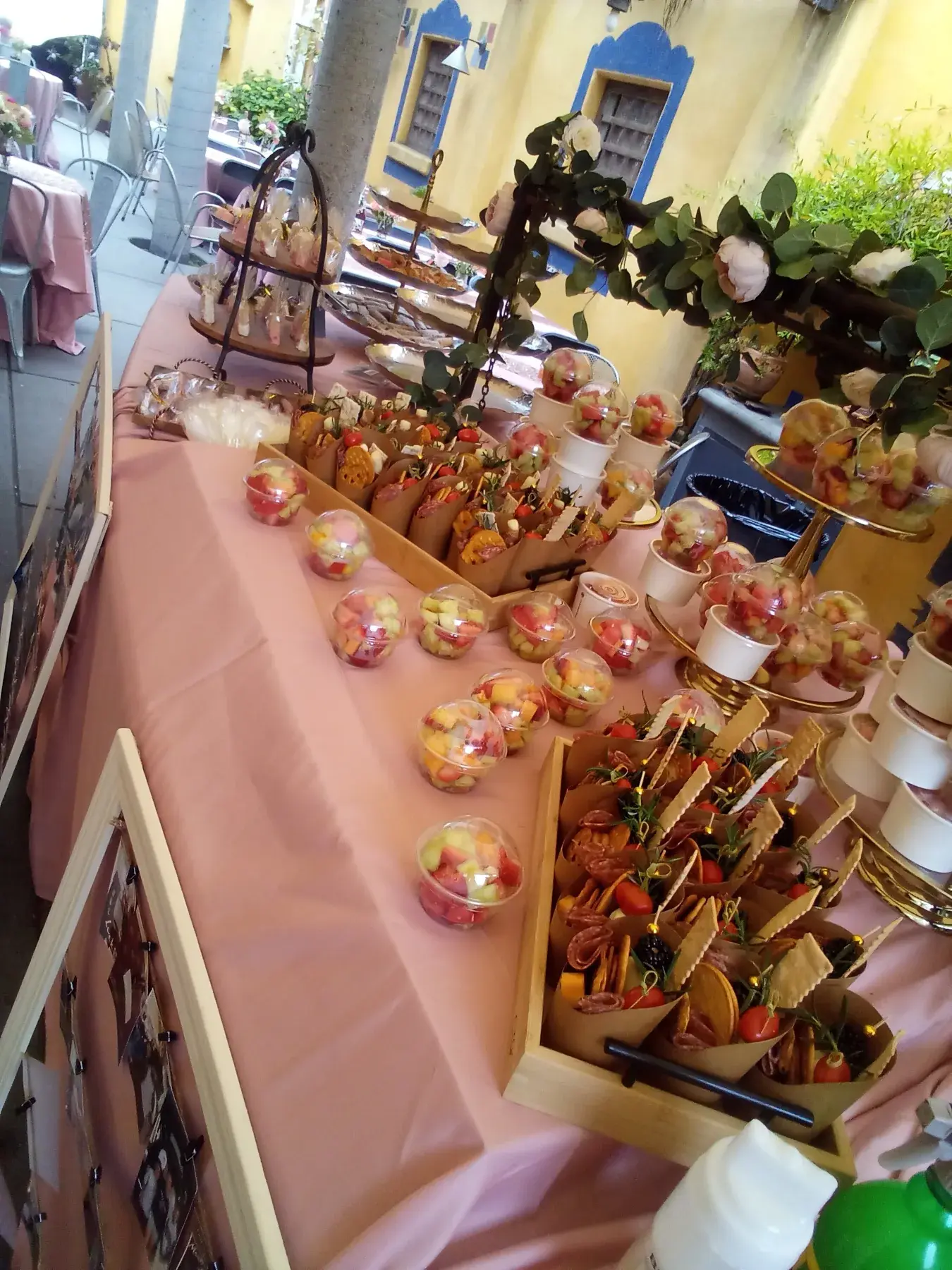 A welcoming event table with appetizers and fresh fruit.