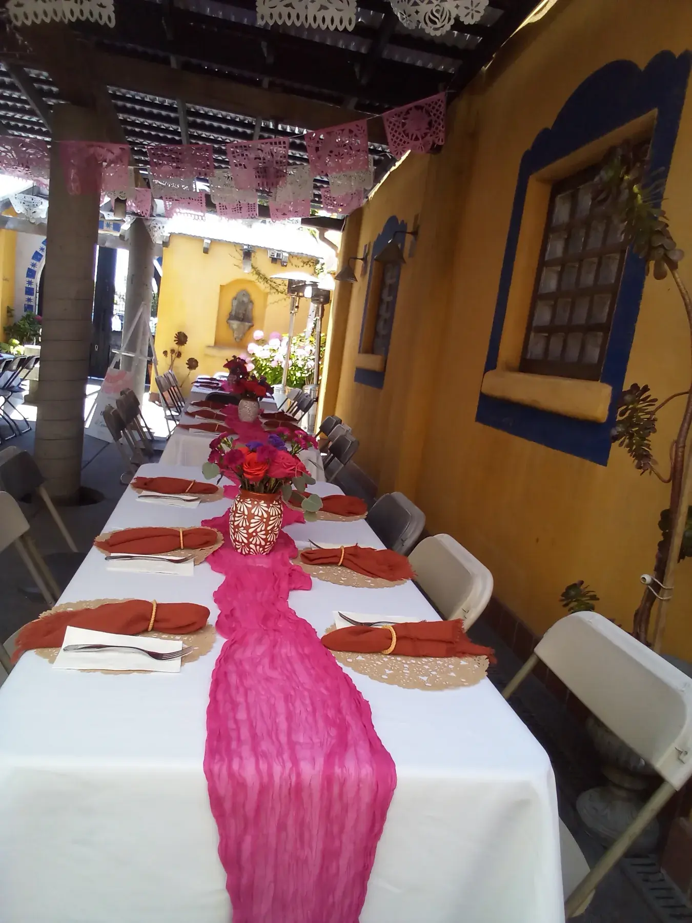 Colorful event table styling with vibrant linens and festive details.